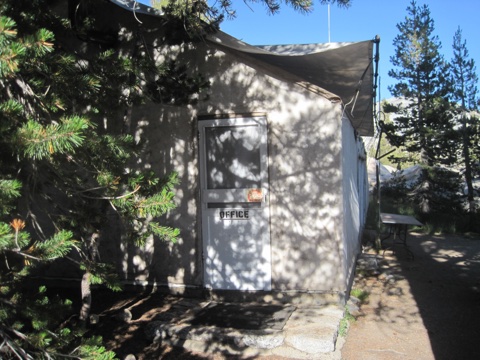 The camp office tent in morning light.